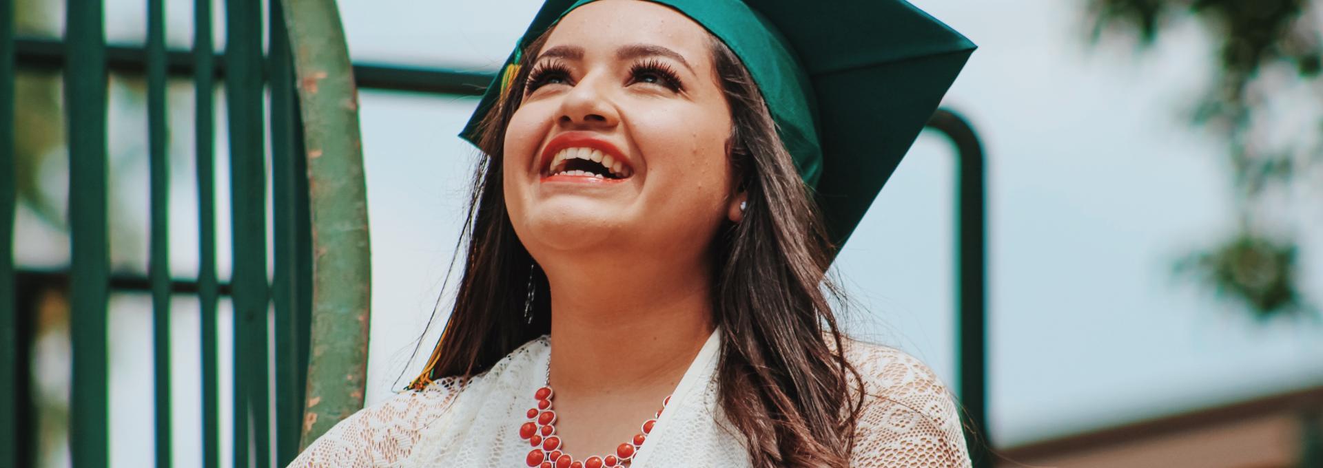 Graduating Student girl looking upward smiling