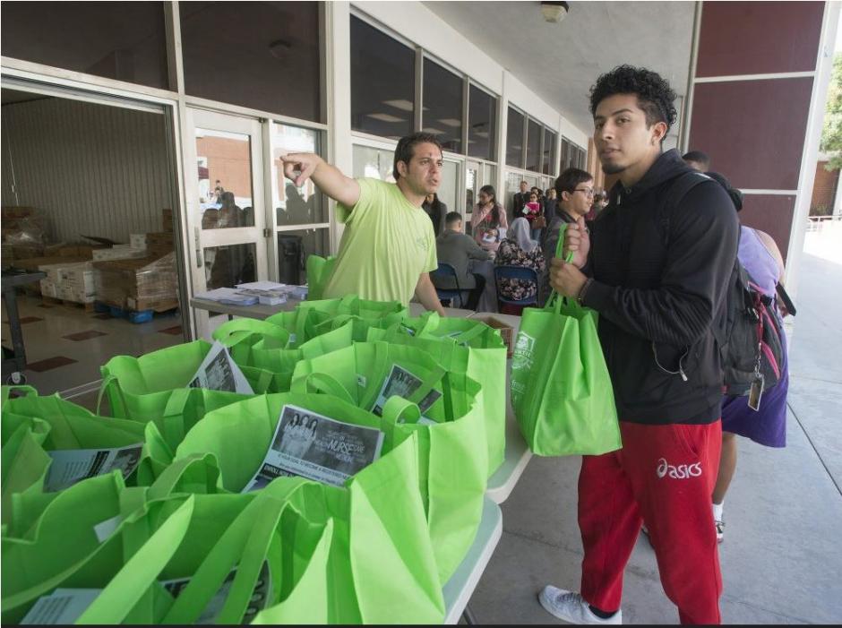 A student pick up food at Mount San Antonio college food pantry
